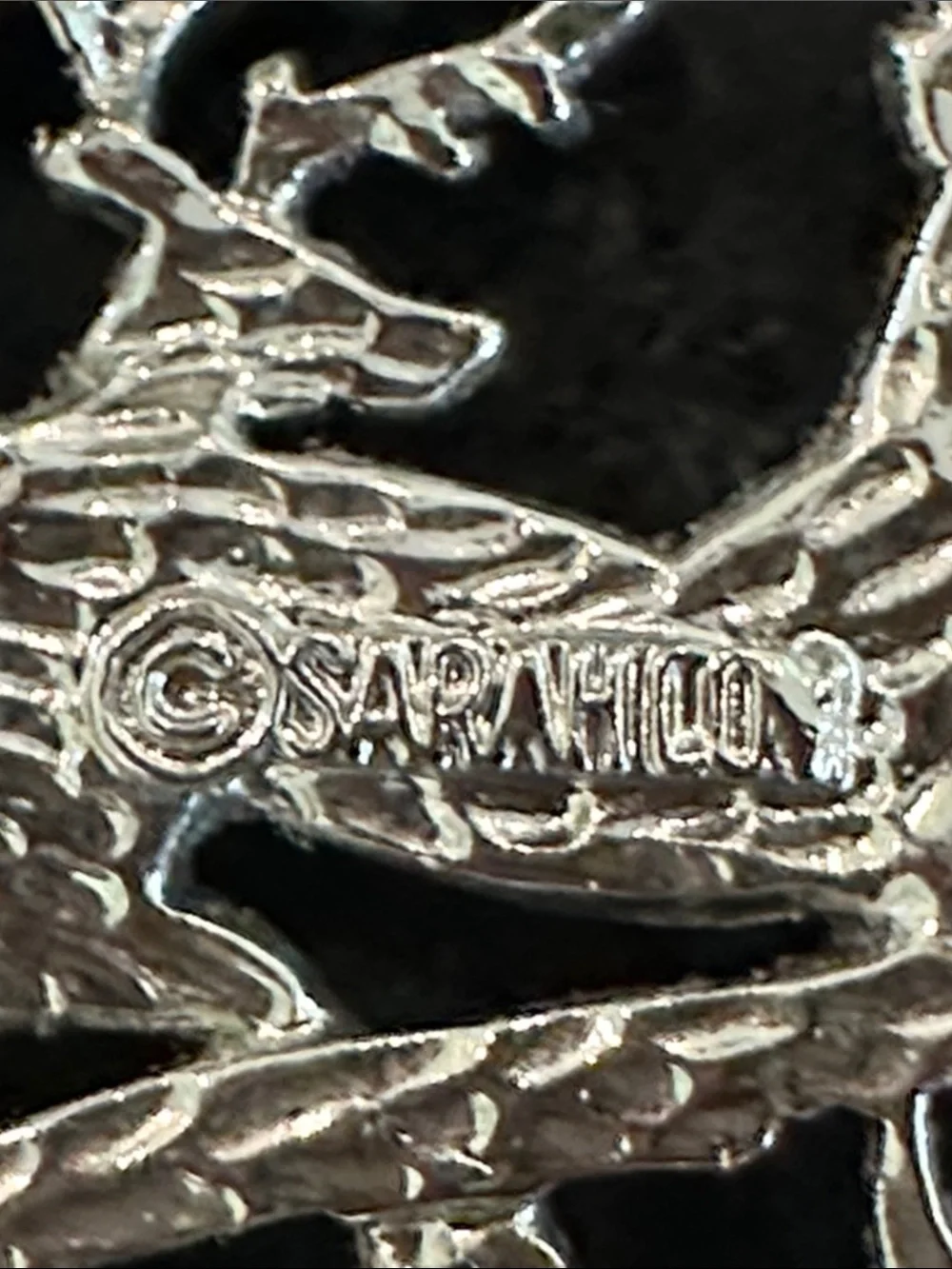 Sarah Coventry Christmas brooch, featuring deer and pine bows